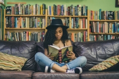 young-woman-reading-seven-shooter-unsplash